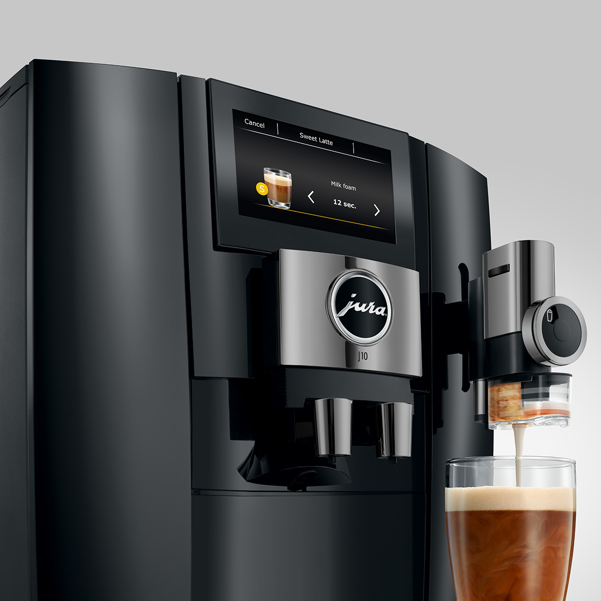 Egy fekete kávéfőző kávét főz egy pohárba.