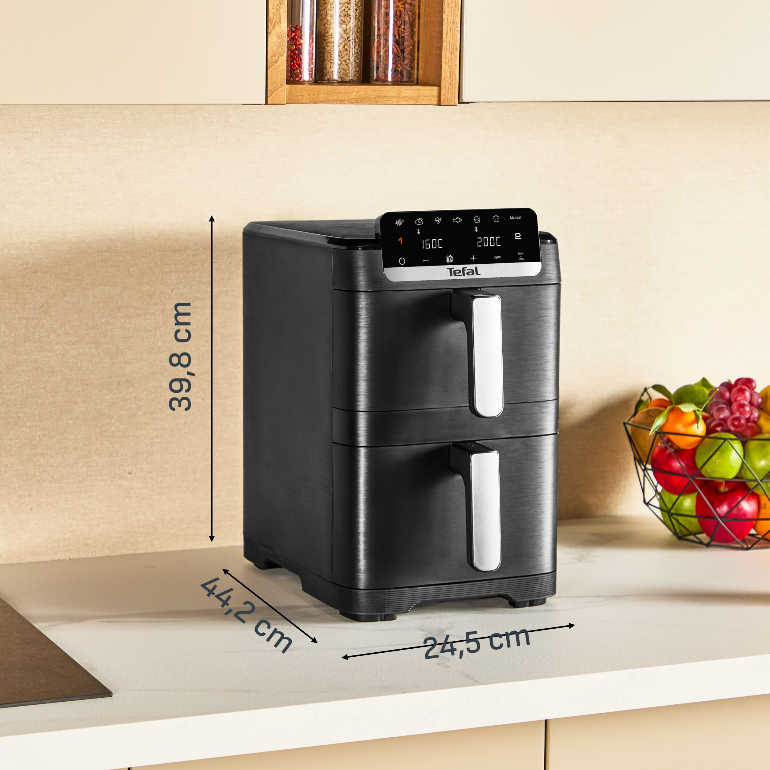 Schwarzer Tefal Heißluftfritteuse mit zwei Schubladen auf einer Arbeitsplatte.