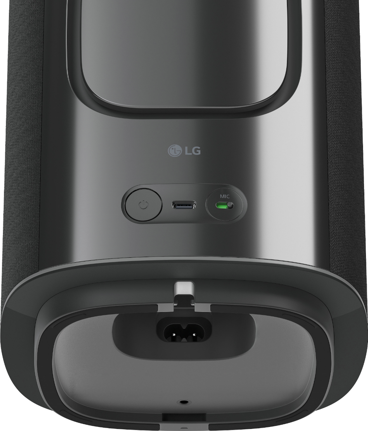 Gros plan d'un haut-parleur LG noir montrant les ports d'alimentation, USB et micro.