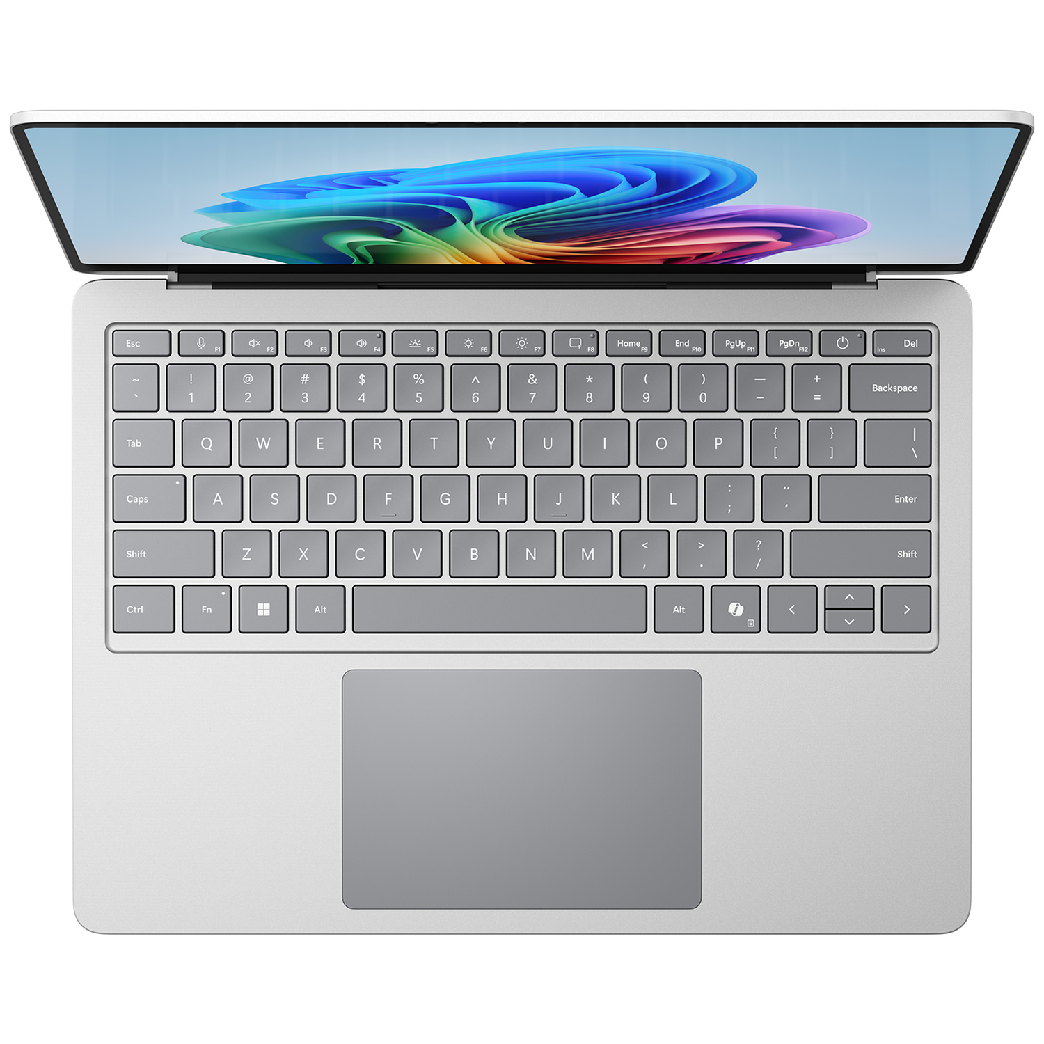 Silver laptop with screen open displaying a colorful abstract wallpaper. Keyboard and trackpad visible.