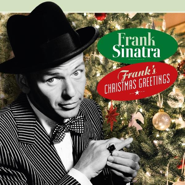 Frank Sinatra trägt einen Hut und eine Fliege vor einem Weihnachtsbaum.