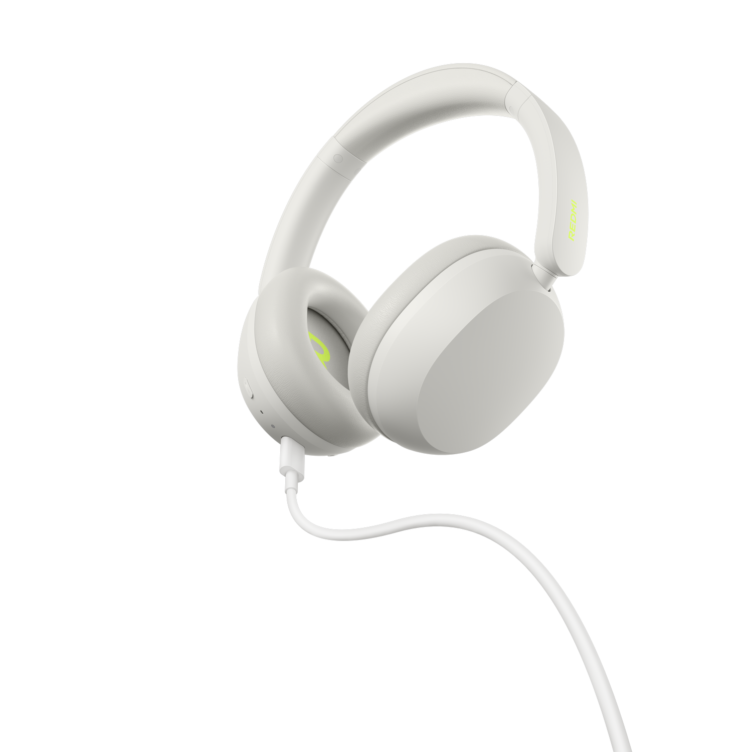 Auriculares blancos de diadema con cable blanco y detalles verdes sobre fondo gris.