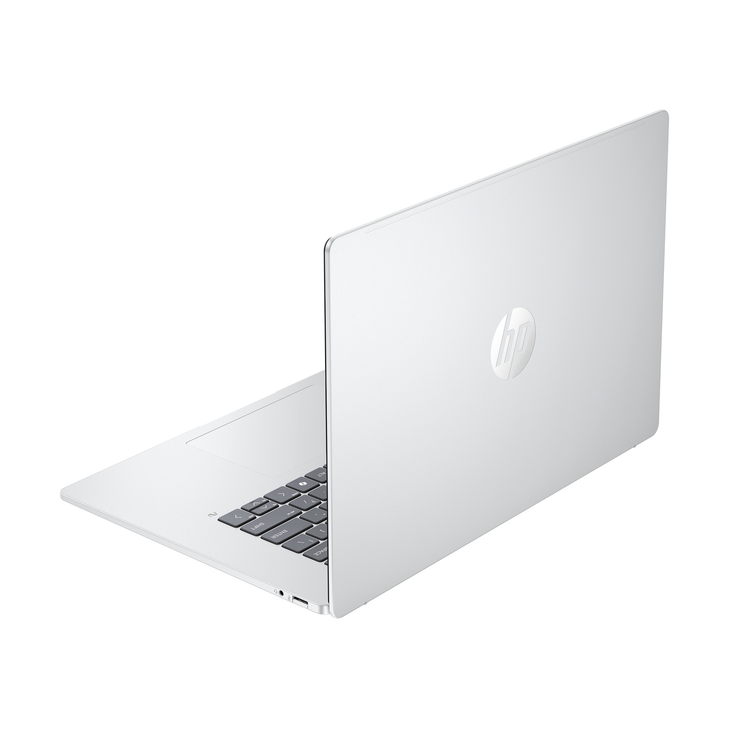 Un laptop HP argentato, mostrato da dietro a sinistra, con tastiera illuminata.