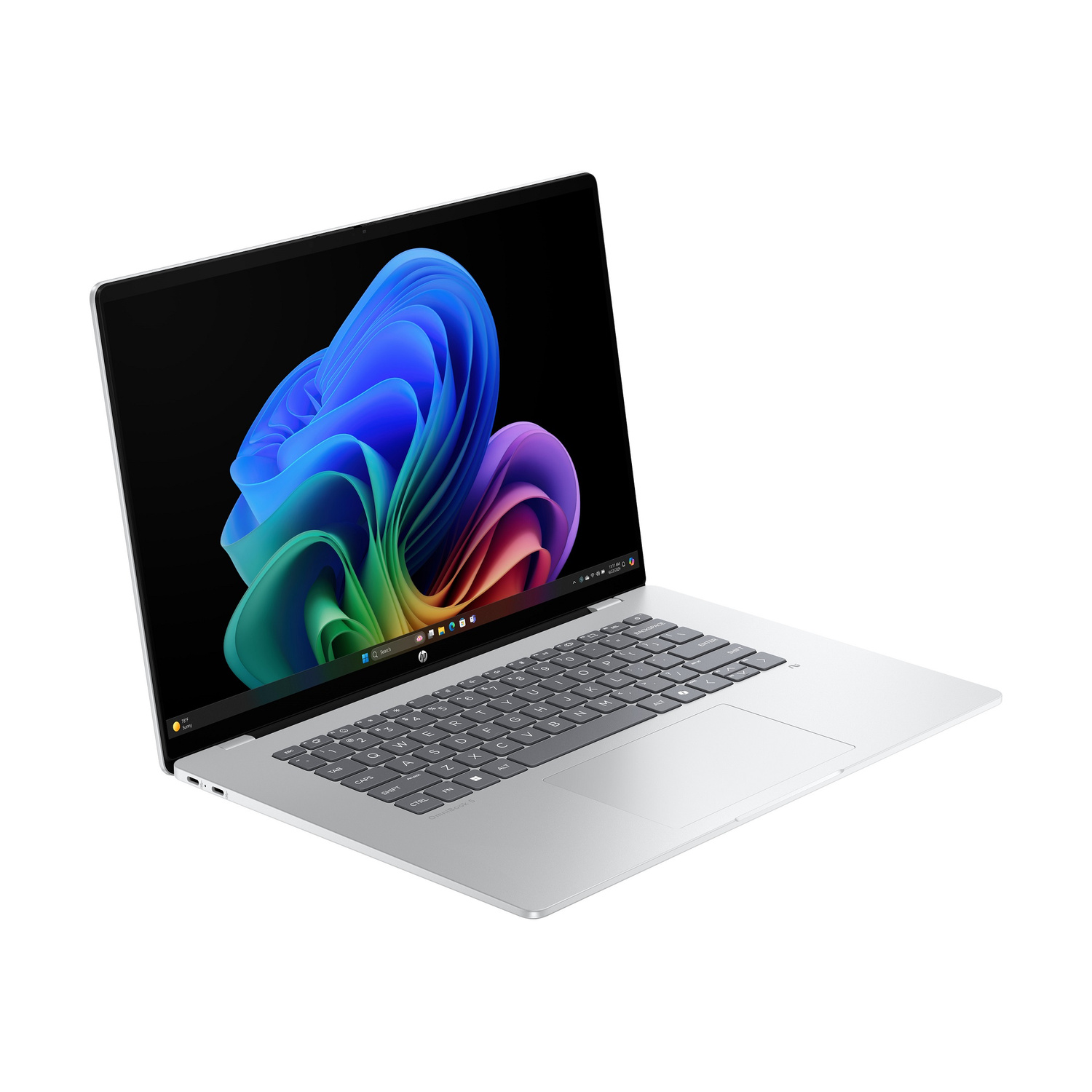 Un laptop argentato che visualizza uno sfondo colorato sul suo schermo.