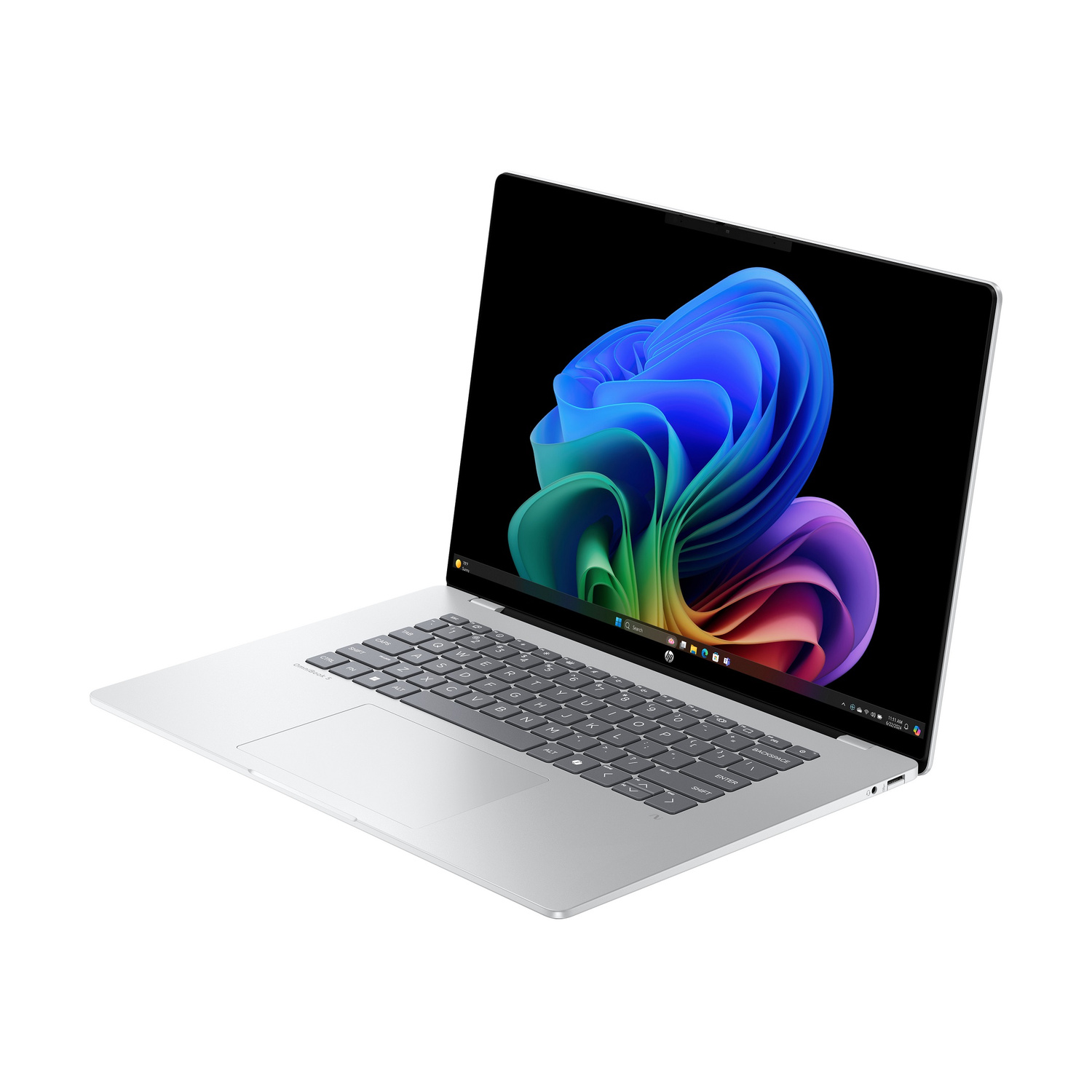 Un laptop argentato con uno sfondo colorato sullo schermo.