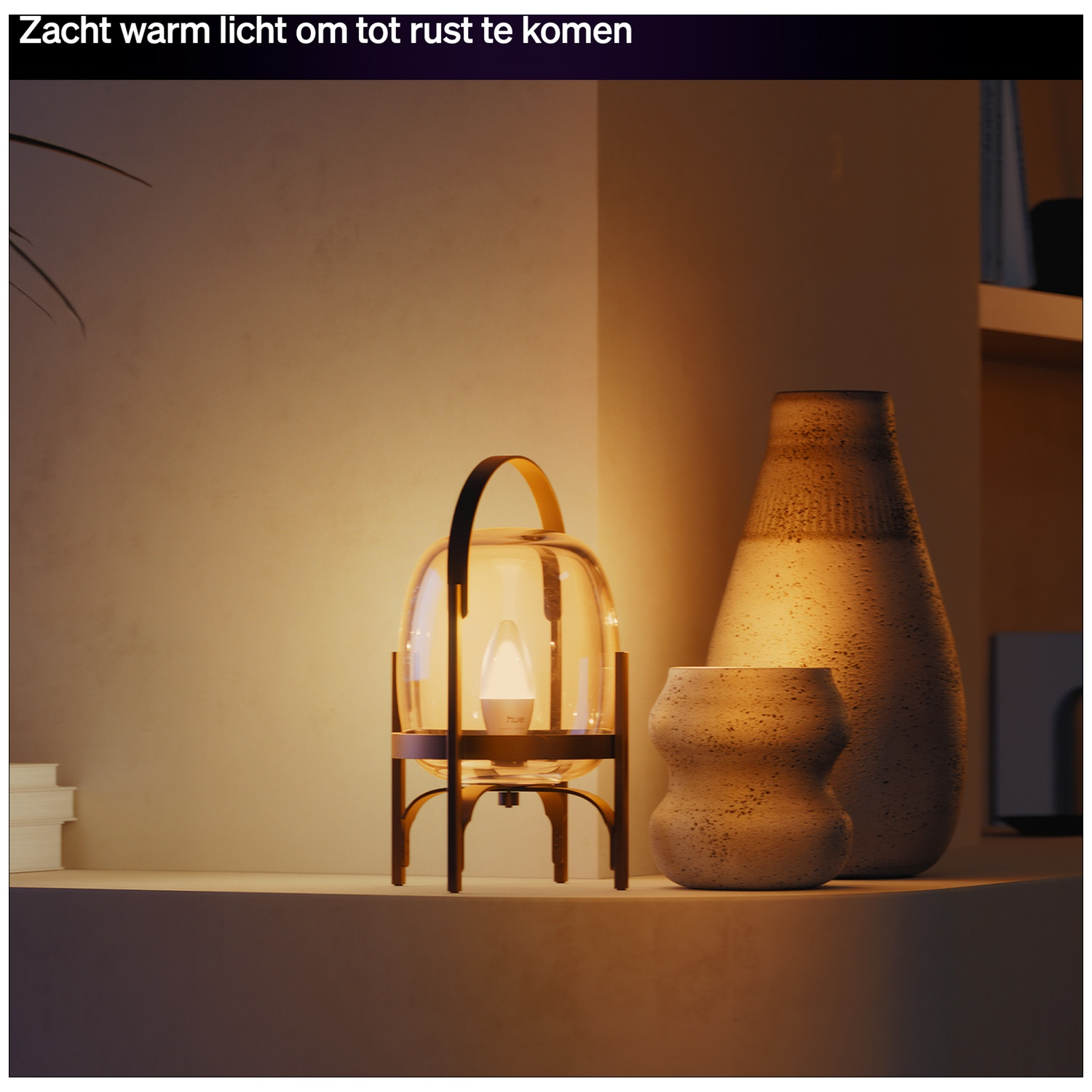 An amber glass lamp with a gold handle sits next to two vases.