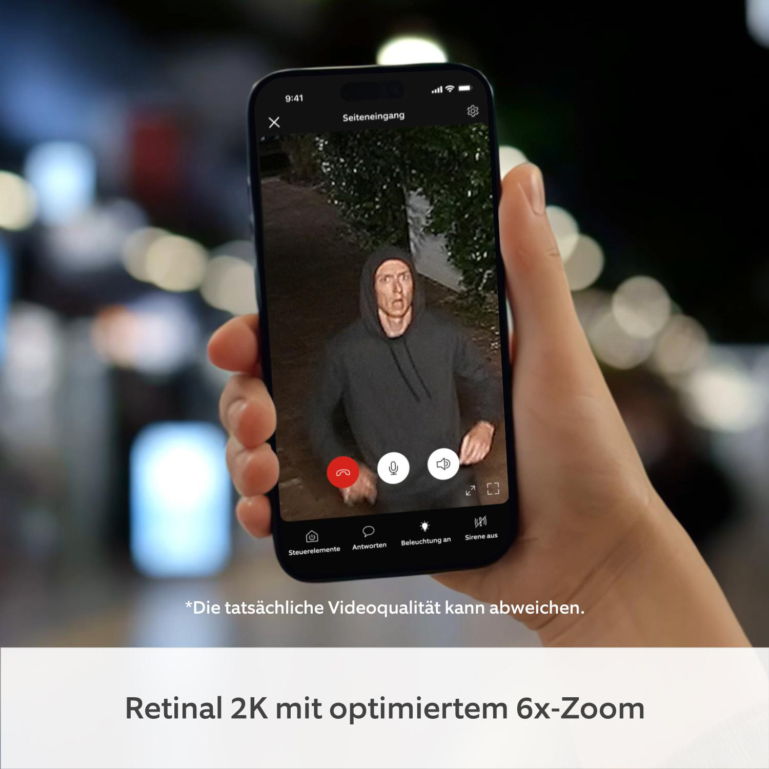 Mann in Kapuzenpullover auf Handy-Display, Nachtaufnahme, mit Bedienelementen.