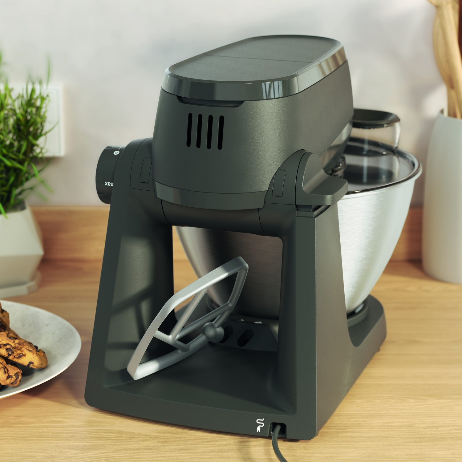 Dark gray stand mixer with stainless steel bowl and flat beater on a wooden countertop.