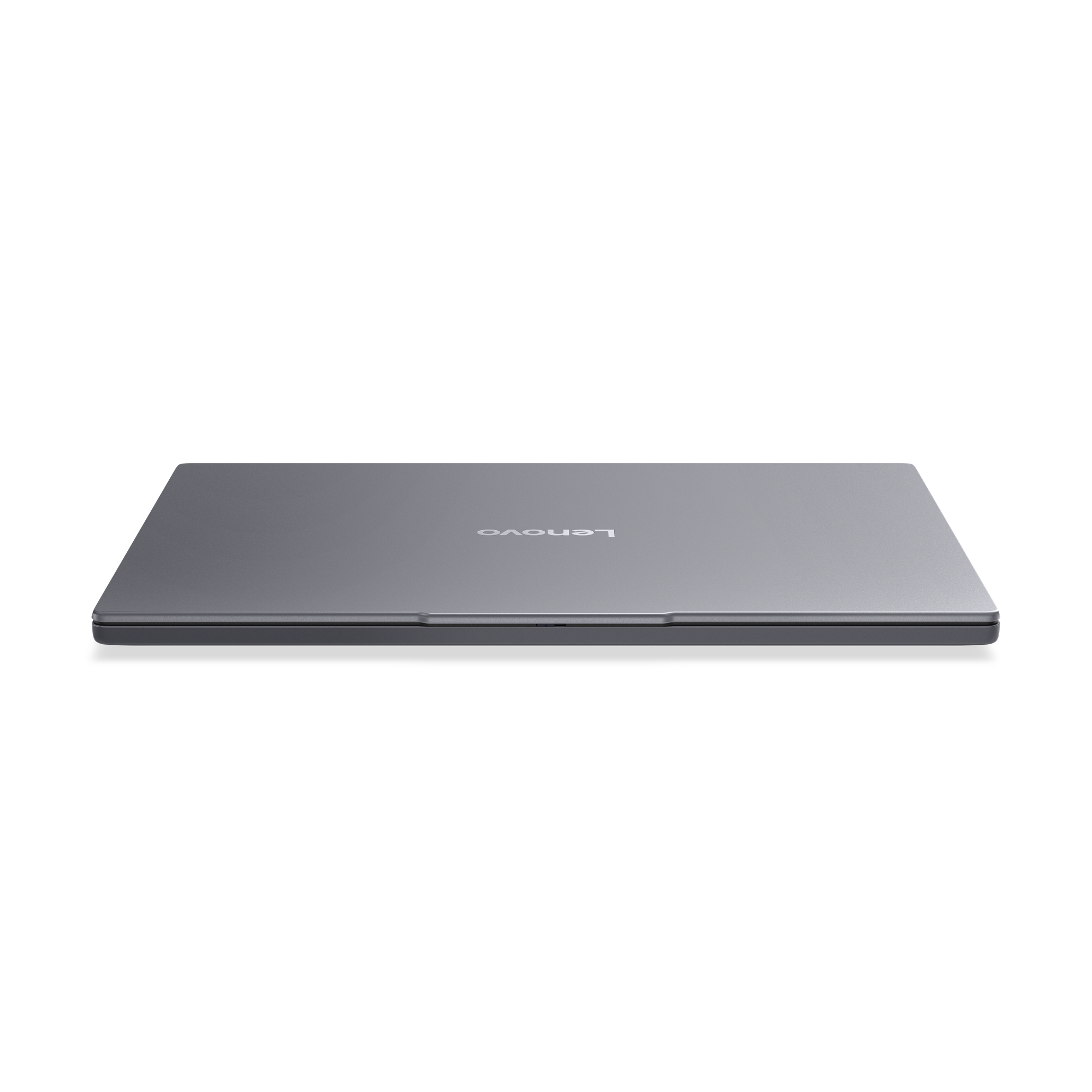 Geschlossener, grauer Lenovo Laptop auf schwarzem Hintergrund.