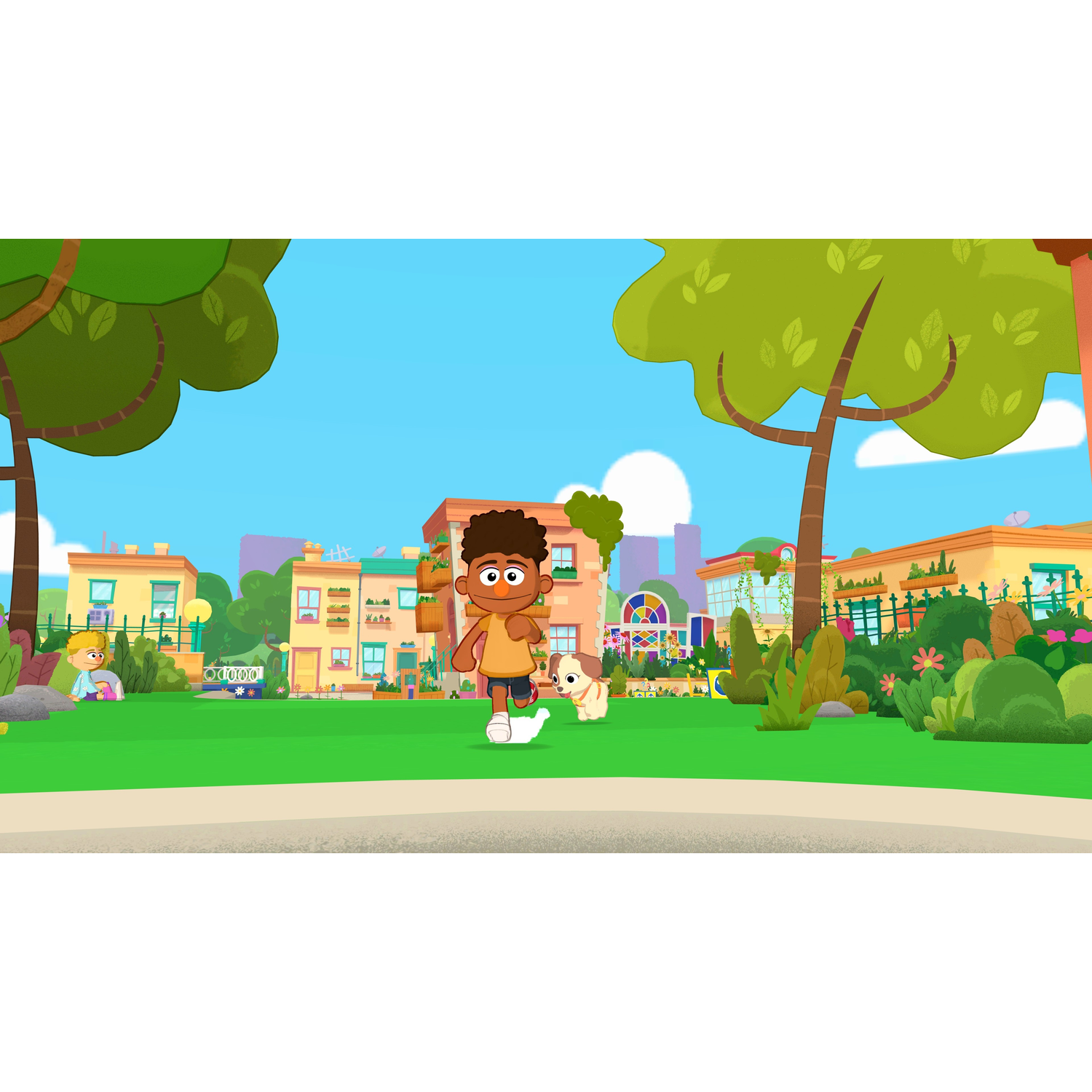 A boy and a dog run on a green lawn in front of colorful houses and trees.