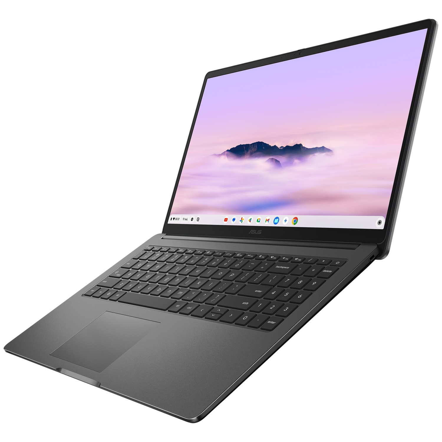 Un ordinateur portable sombre ouvert affichant un fond d'écran de montagne et un clavier.
