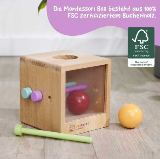Holz Montessori Box mit rotem Ball drin. Grüner Stift & orange Ball draußen.
