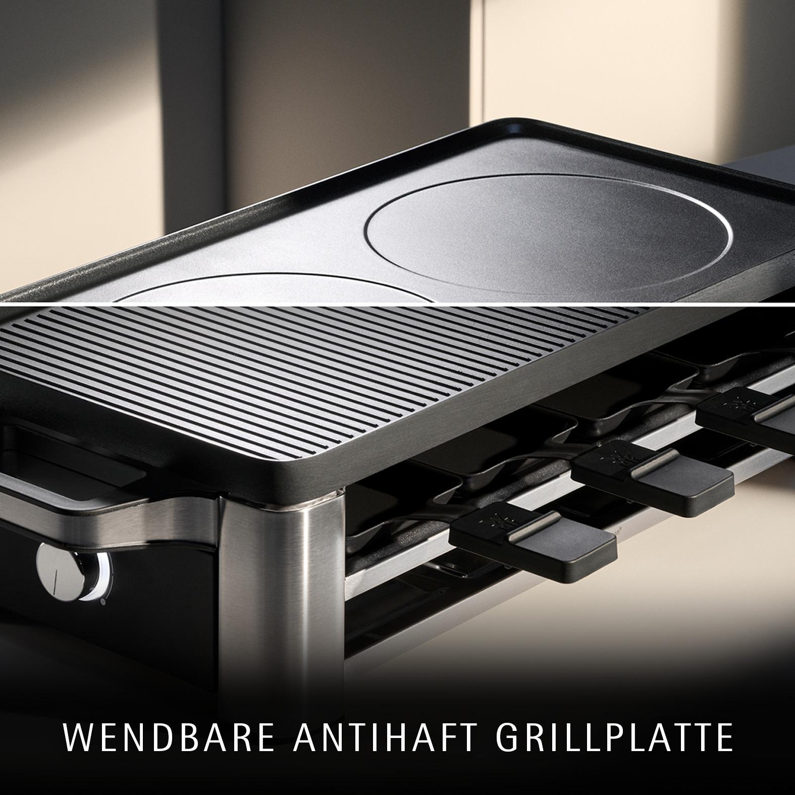 Eine Nahaufnahme eines Raclette-Grills mit Wendegrillplatte und Pfännchen.