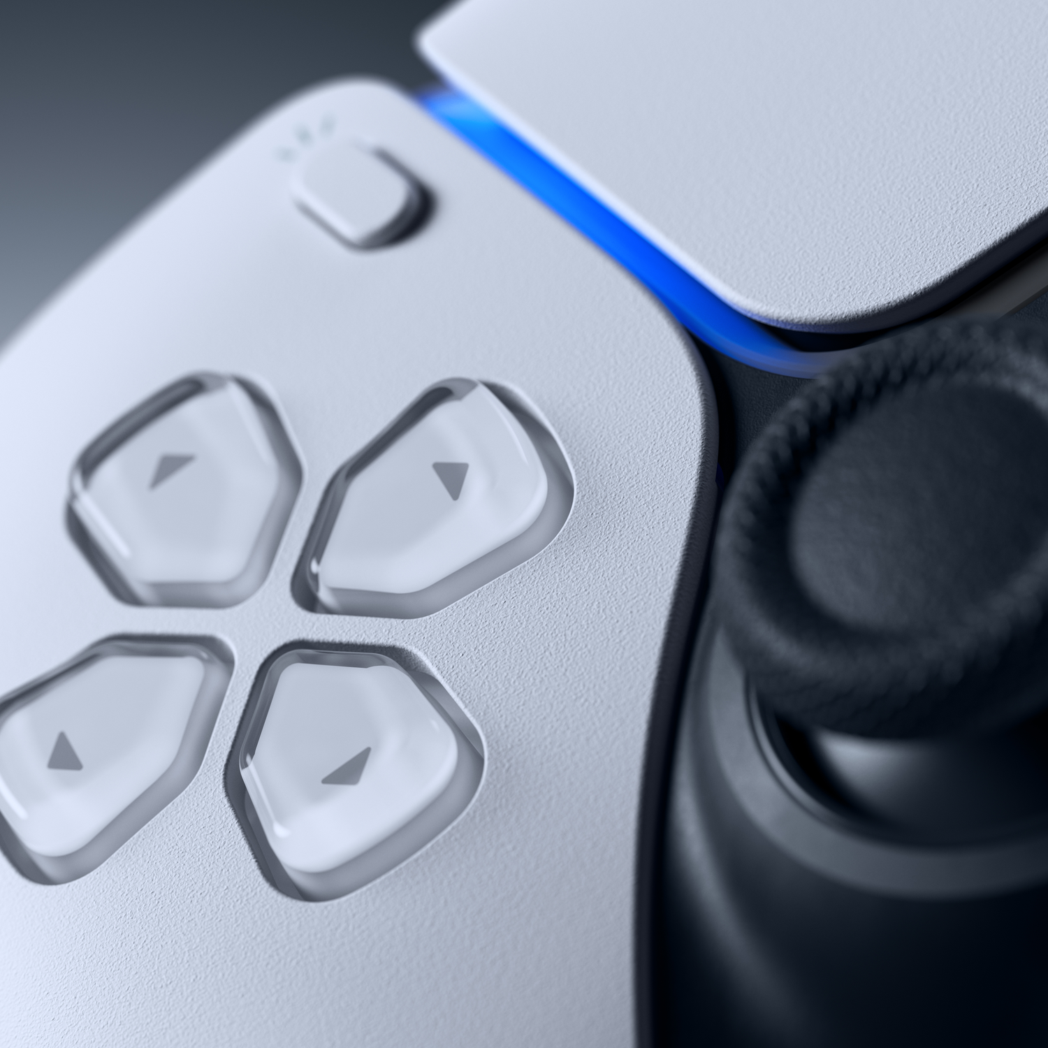 Close-up van een witte controller met blauwe accenten en een zwarte joystick.