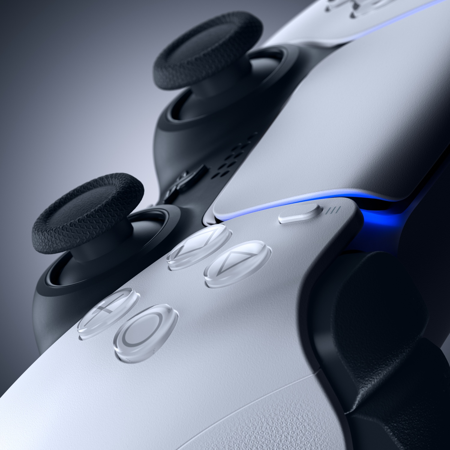 Close-up van een wit en zwart gamecontroller met blauwe lichten.
