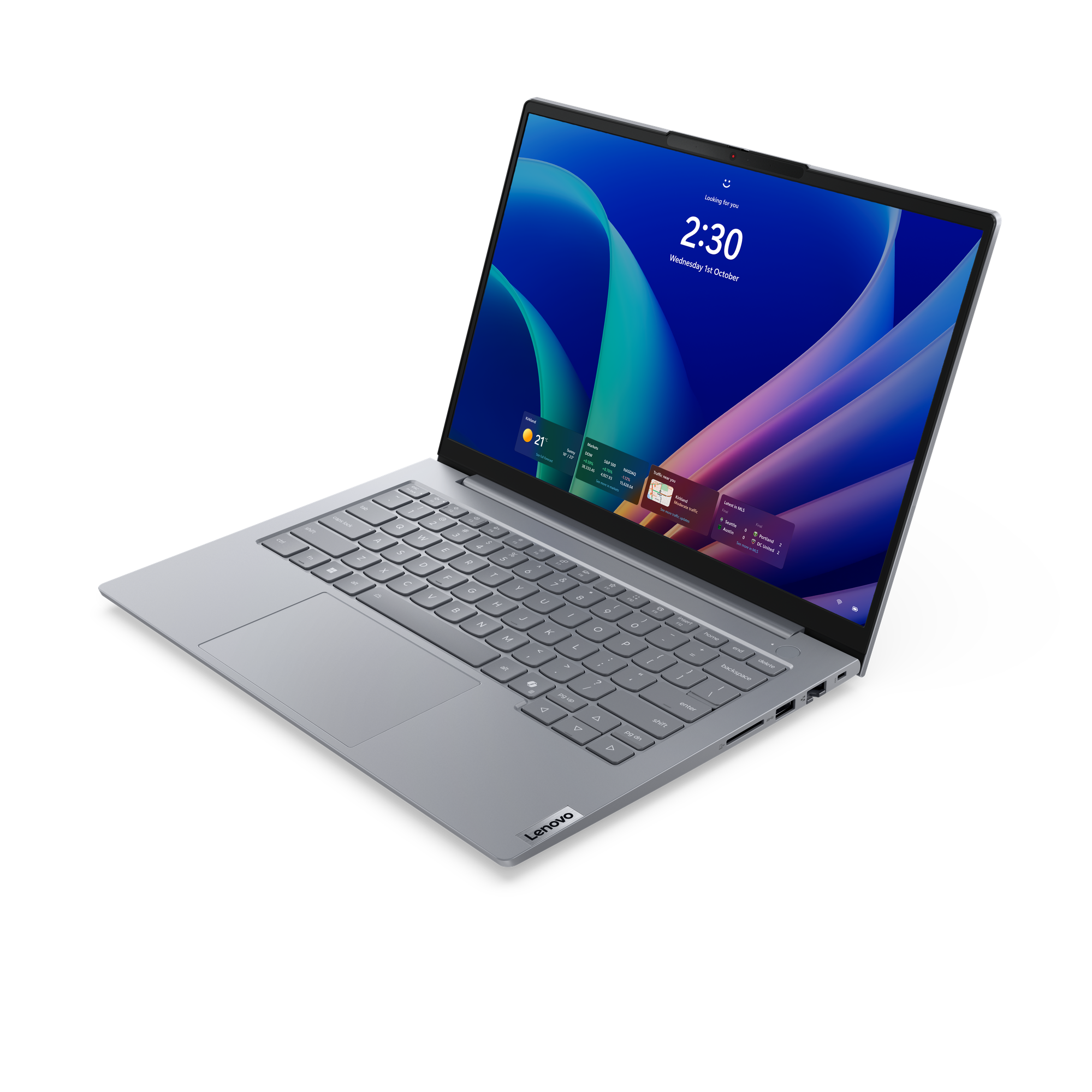 Ein graues Lenovo-Laptop auf schwarzem Hintergrund, mit einem blauen Hintergrundbild.