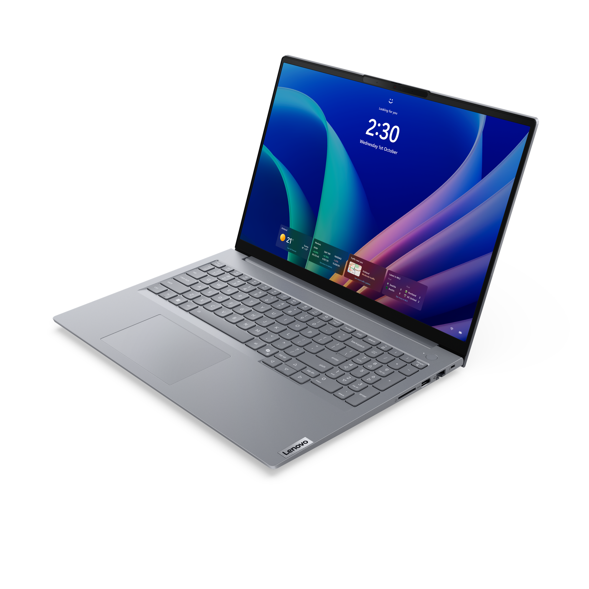 Ein silberner Lenovo Laptop mit einem blauen und grünen Hintergrundbild auf dem Bildschirm.