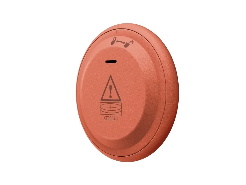 Dispositivo naranja con símbolo de advertencia y número de modelo XT2561-1.