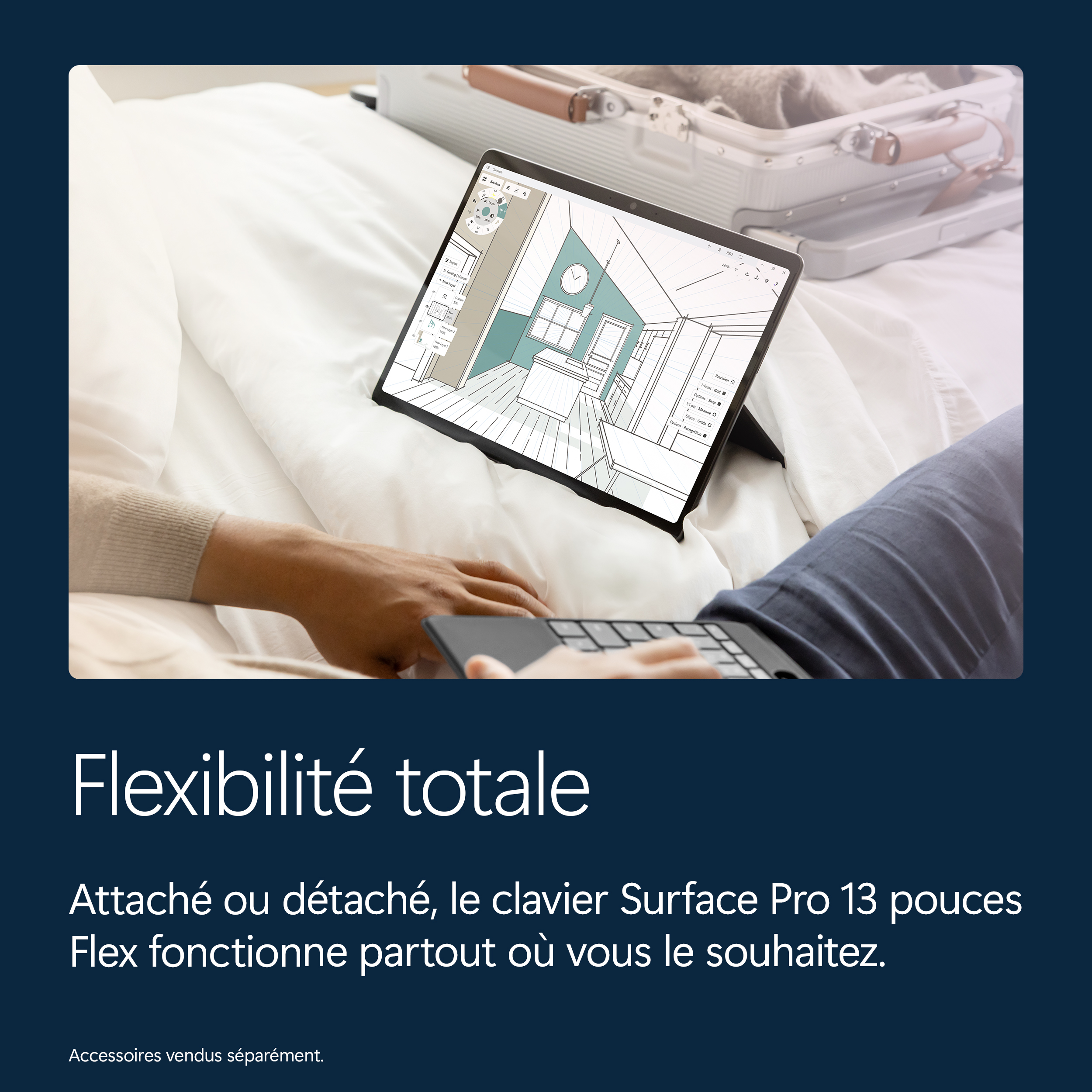 Une personne sur un lit utilise une tablette avec clavier, montrant une conception de cuisine.