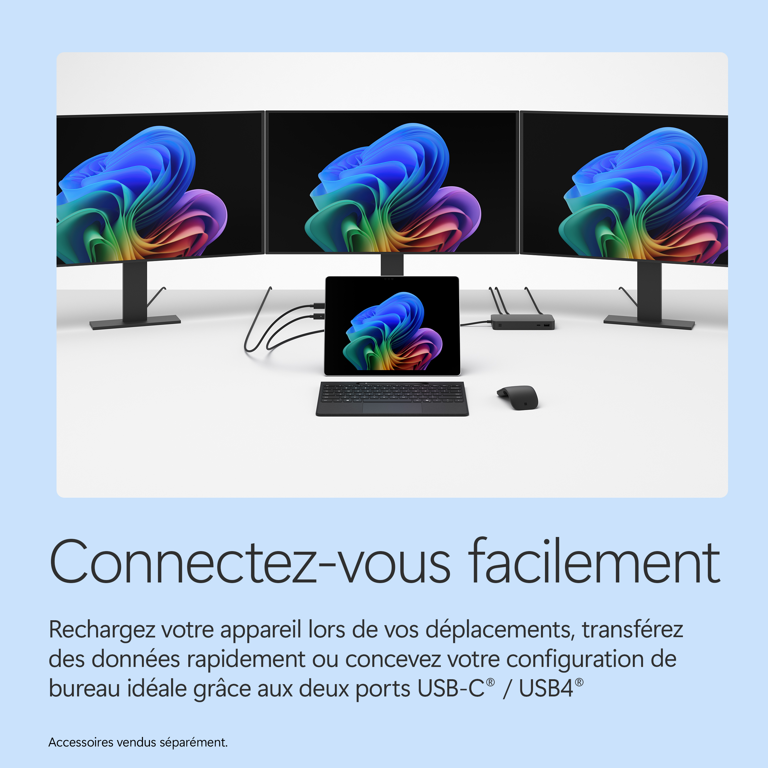 Trois moniteurs, une tablette, un clavier et une souris sur un bureau.