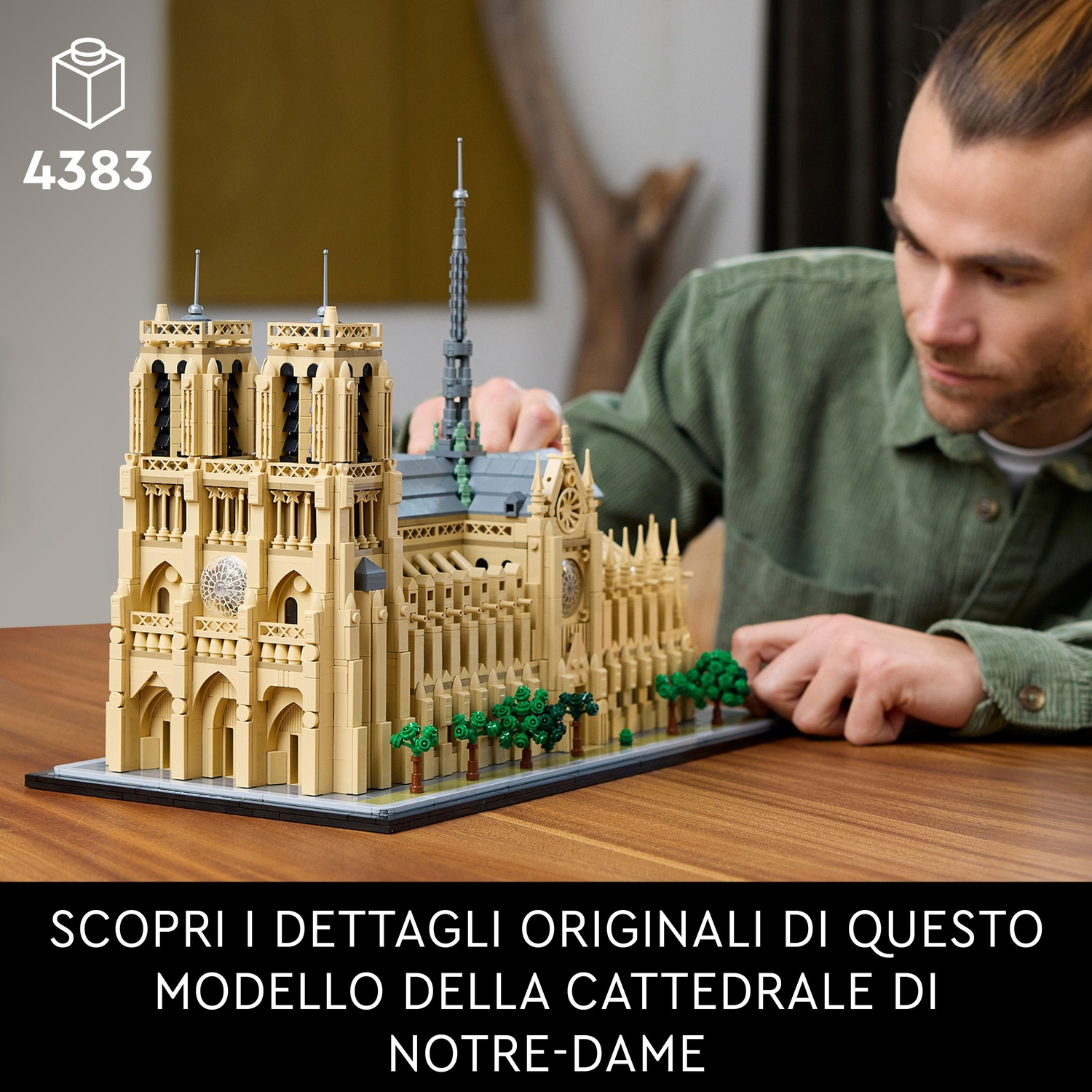 Un uomo costruisce un dettagliato modello Lego della cattedrale di Notre-Dame.