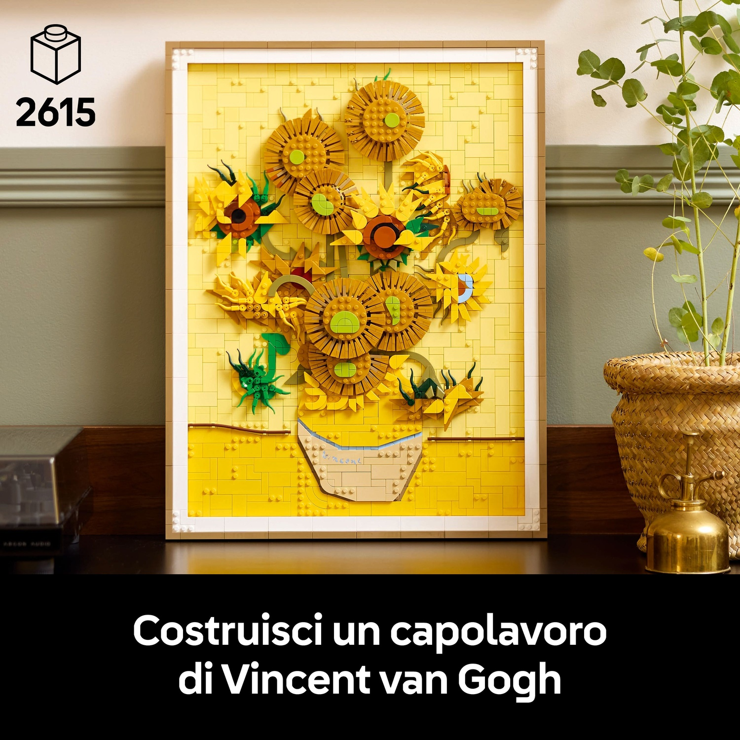 Un mosaico LEGO dei Girasoli di Van Gogh in una cornice marrone, vicino a una pianta.