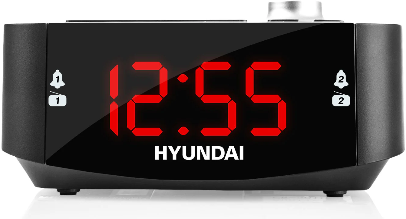 Egy fekete digitális ébresztőóra 12:55-öt mutat, 1-es és 2-es riasztás ikonokkal.