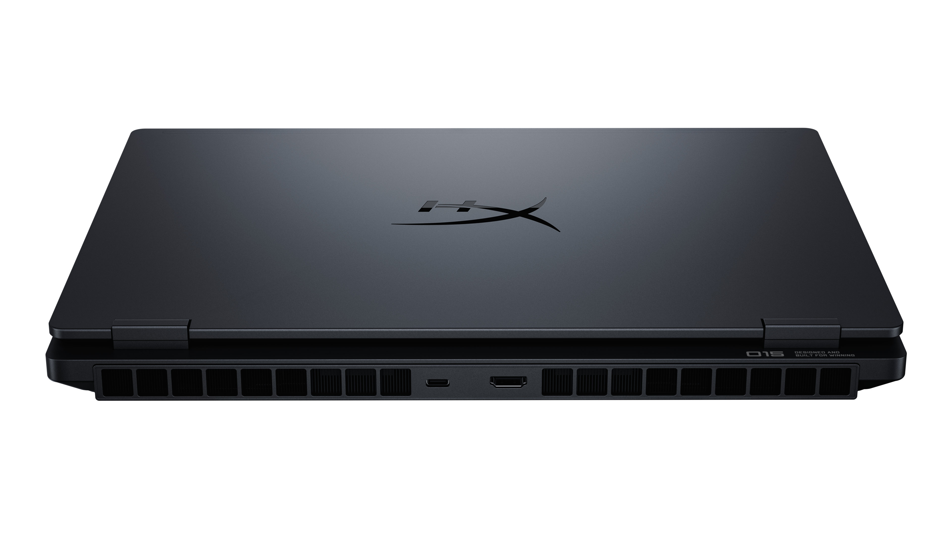 Zamknięty czarny laptop z otworami wentylacyjnymi i portami po bokach.