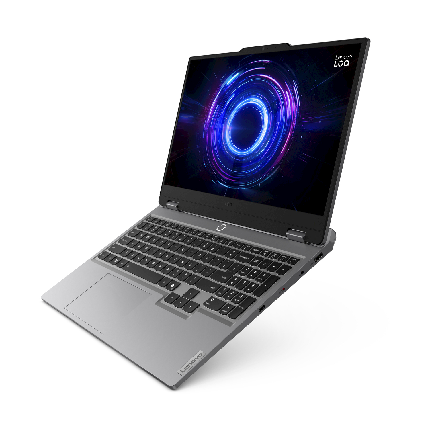 Un laptop Lenovo LOQ argentato è aperto, mostrando una grafica circolare colorata sul suo schermo.