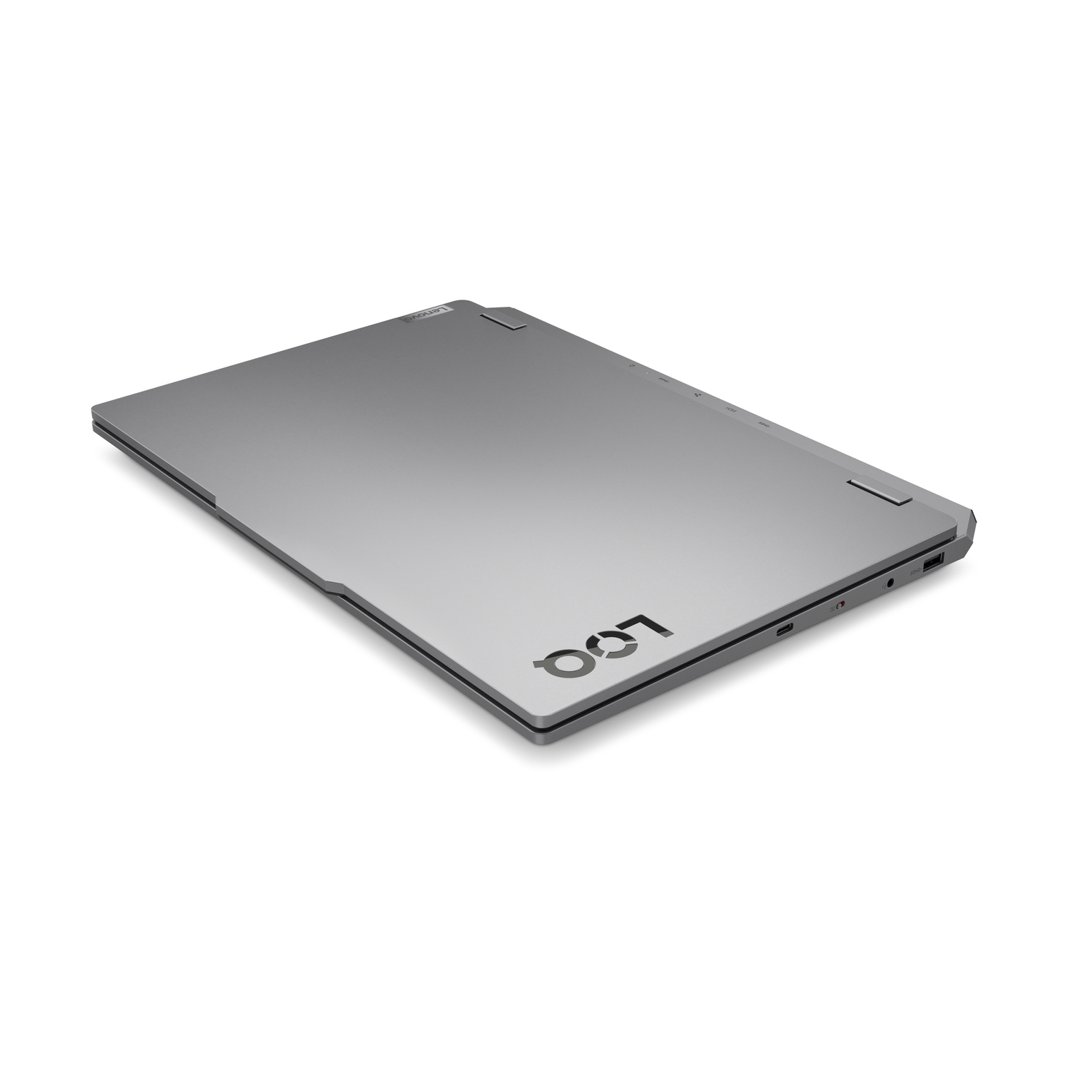 Laptop Lenovo grigio con logo sul coperchio, bordi sottili, porte USB visibili.