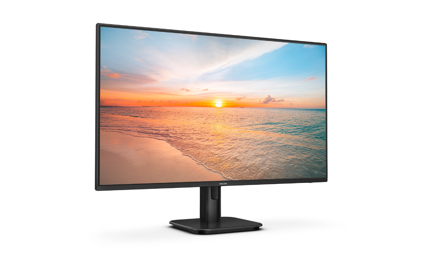 Un monitor muestra una escena de playa al atardecer con agua turquesa.