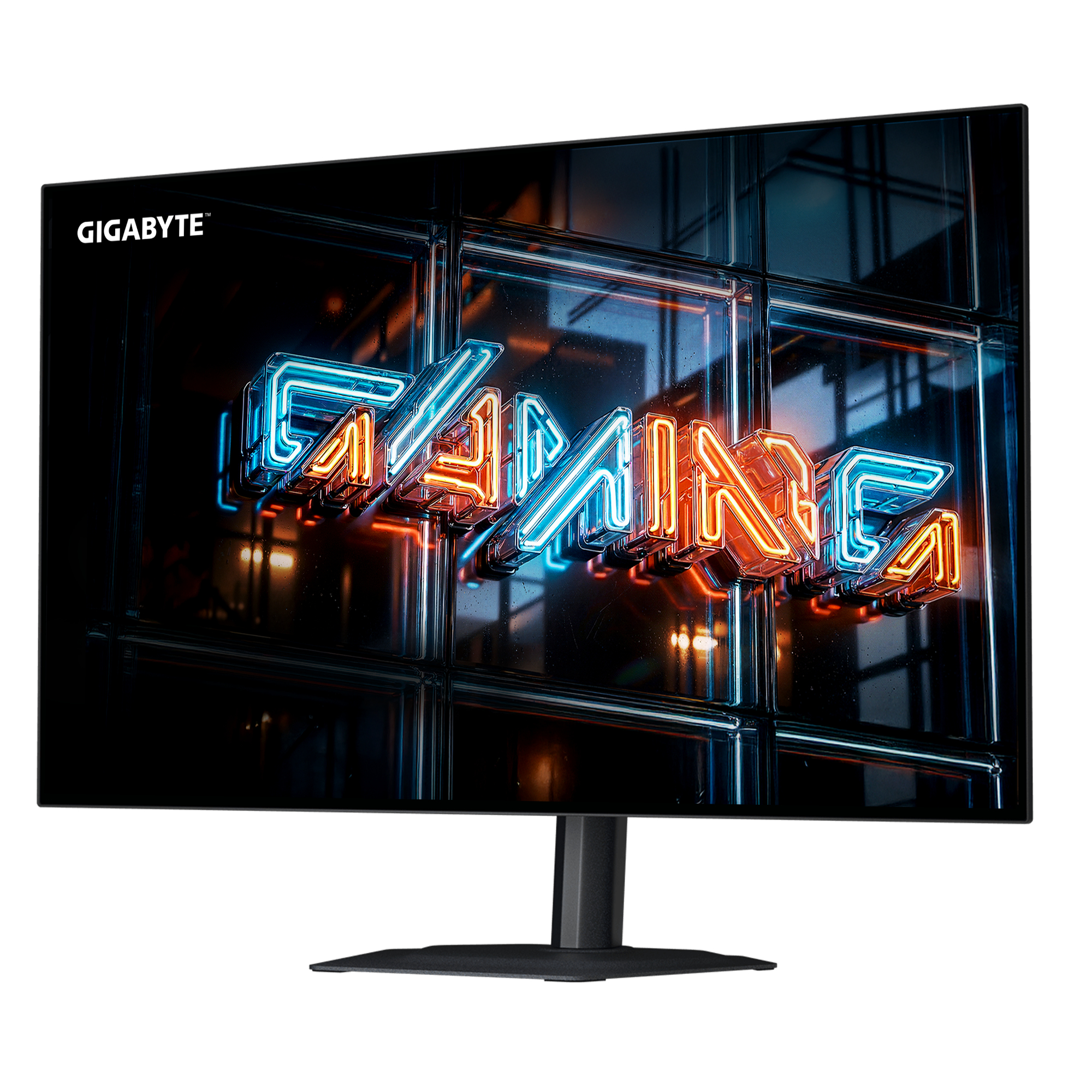 Monitor Gigabyte con texto de neón 'GAMING' en azul y naranja sobre fondo oscuro texturizado.