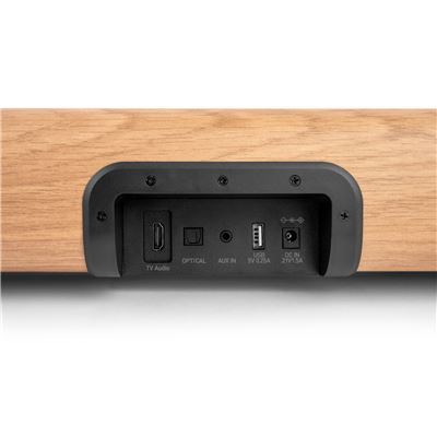 Carcasa de madera con puertos: TV Audio, óptico, Aux In, USB, DC In.