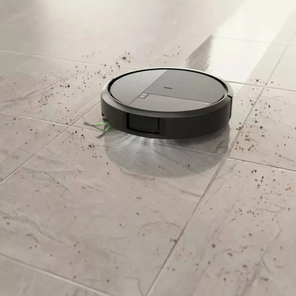 Okrągły robot sprzątający czyści brudną podłogę z płytek.