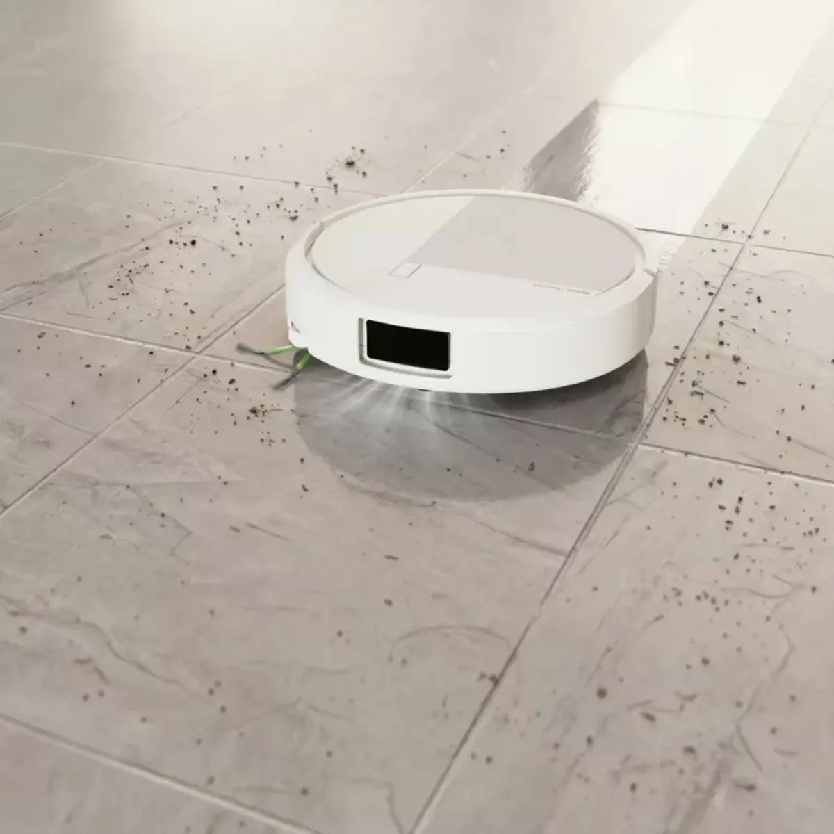 Biały robot sprzątający czyści brudną podłogę z płytek.