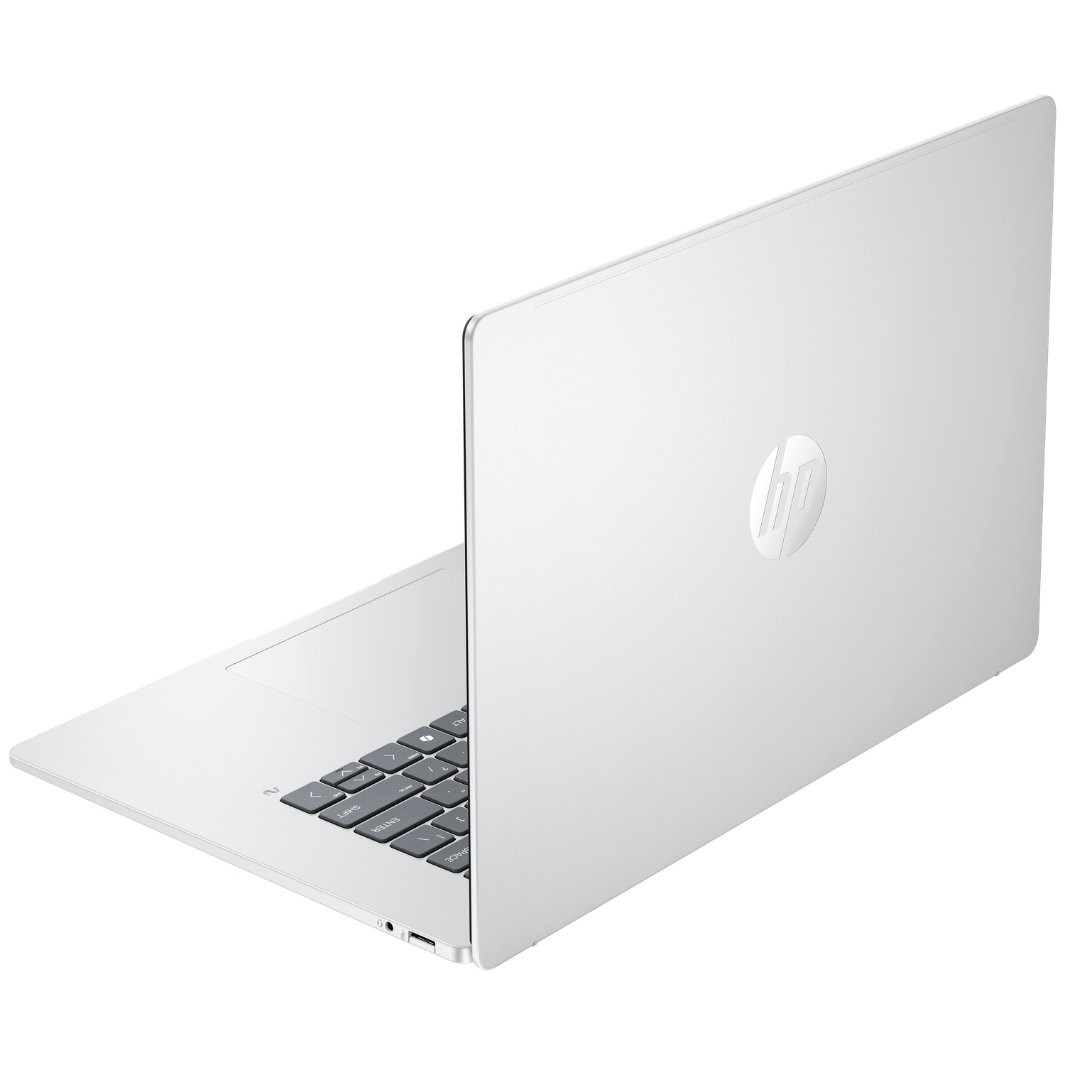 Un ordinateur portable HP argenté est ouvert, montrant le clavier et le logo.