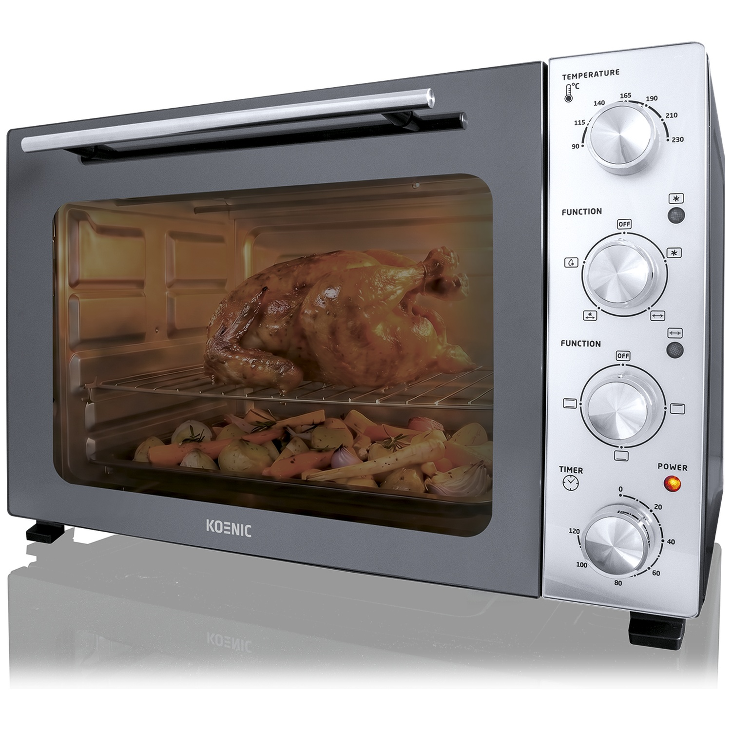 Een gebraden kip en groenten in een Koenic oven met bedieningselementen.