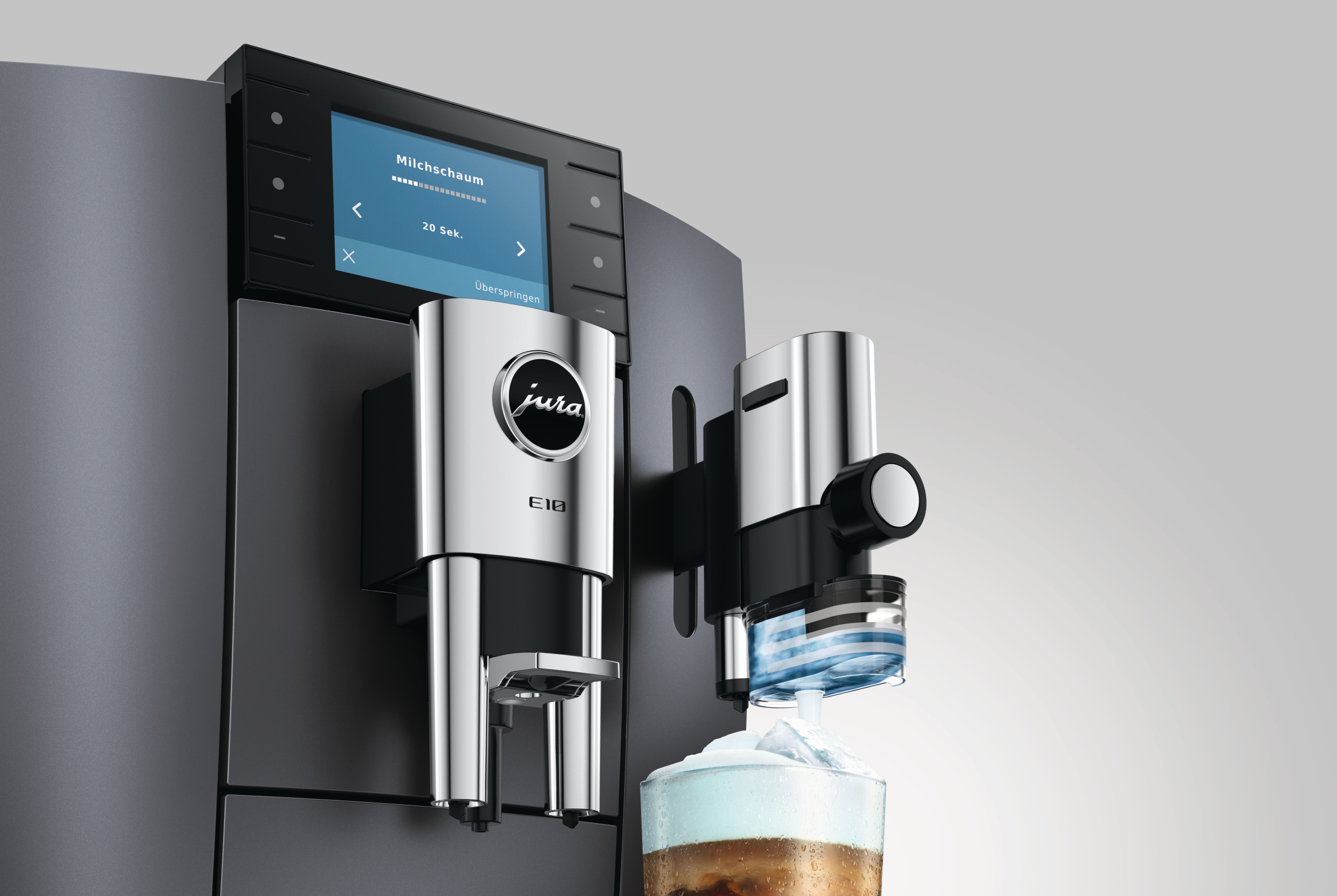 Kaffeemaschine mit Milchaufschäumer und Bildschirm, der Milchschaum anzeigt.