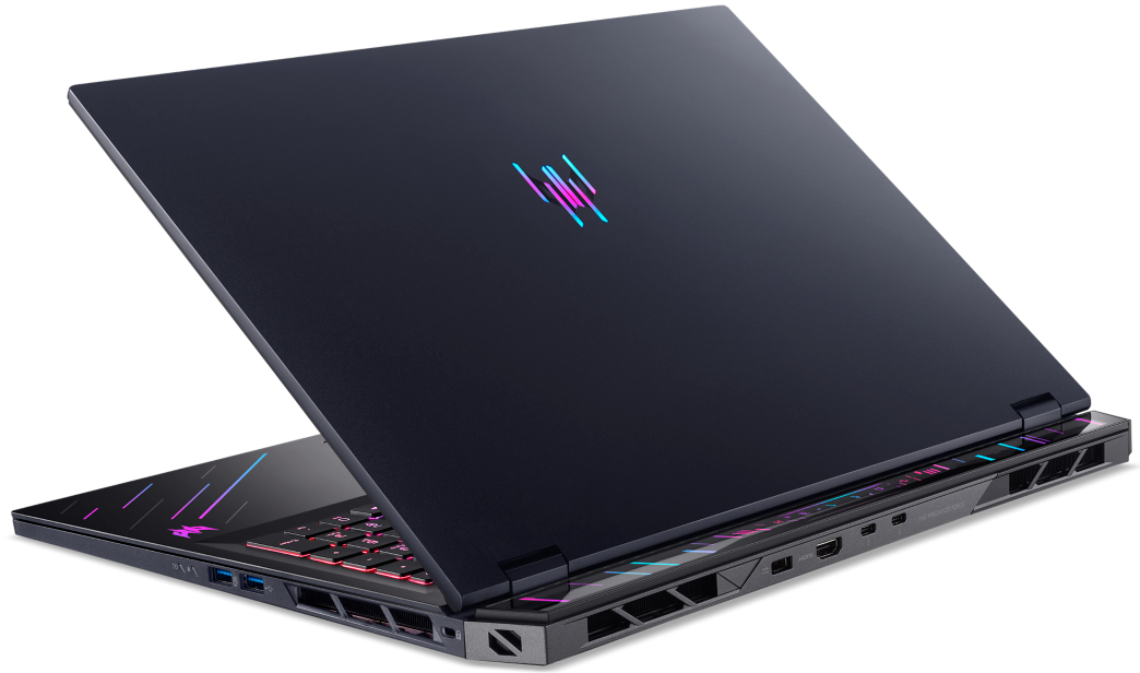 Sötétkék laptop RGB világítással és logóval a fedélen.