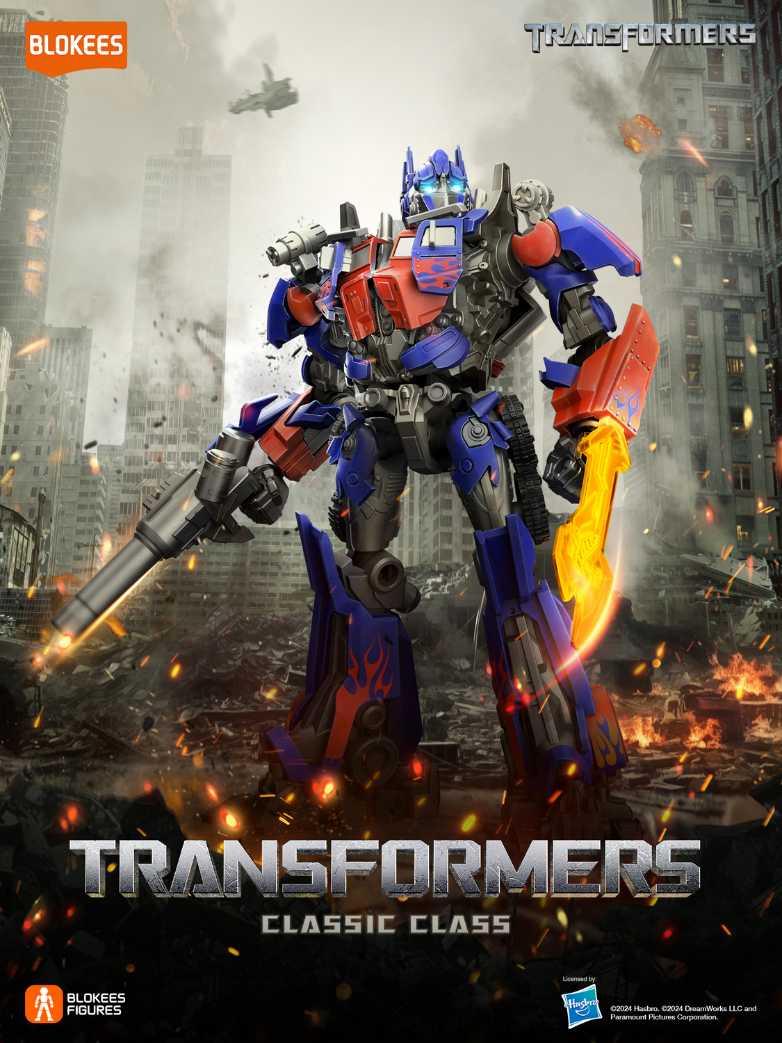 Optimus Prime está en una ciudad destruida con fuego y escombros.