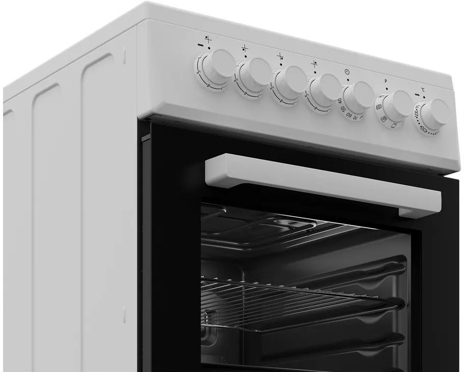 Un four blanc avec sa porte ouverte, montrant des grilles et des boutons.