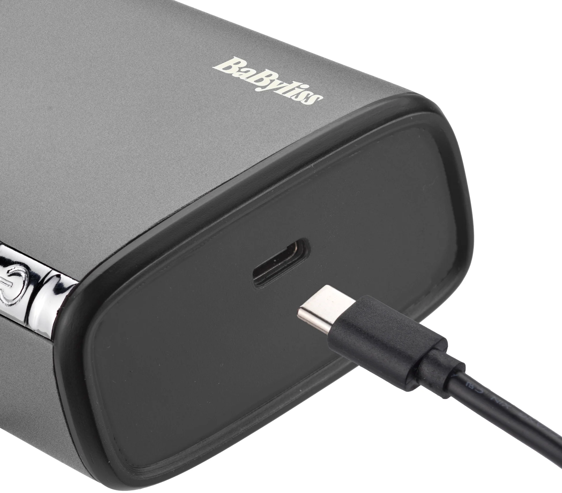 Un dispositivo Babyliss grigio con cavo USB-C collegato.