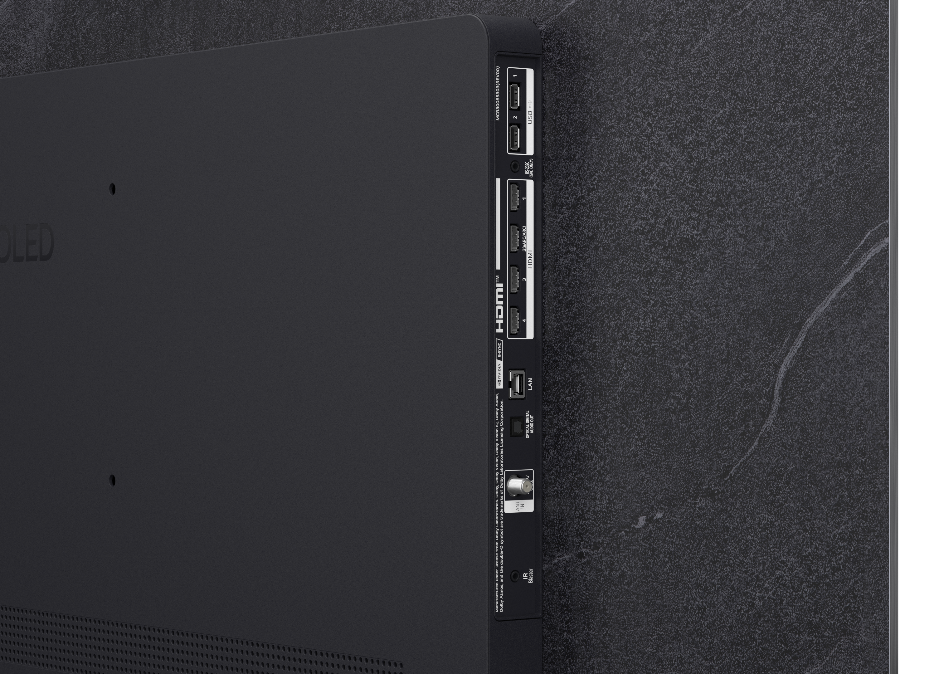 Tył telewizora z portami: USB, HDMI, LAN, wejście antenowe, optyczne wyjście audio.