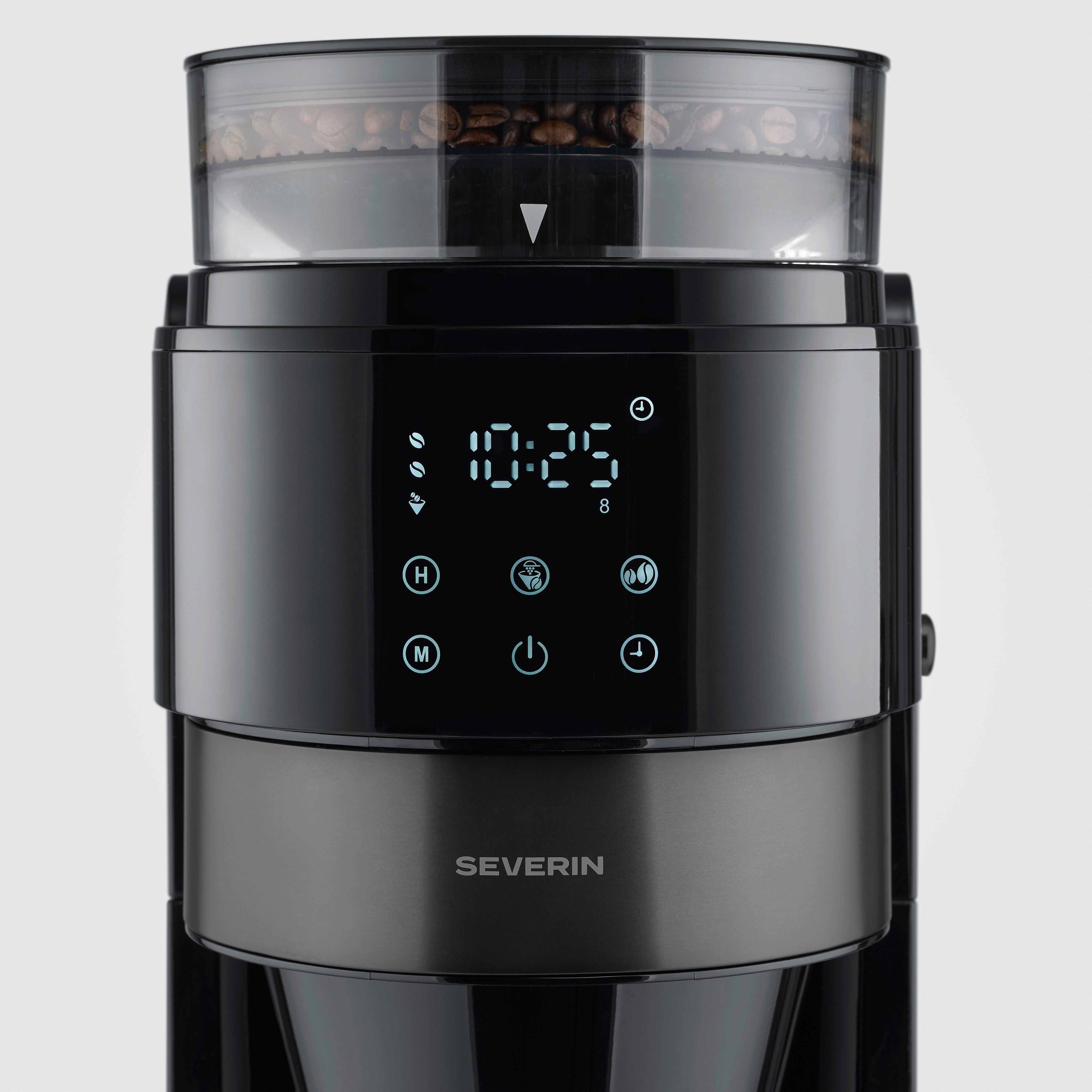 Eine schwarze Kaffeemaschine mit Mahlwerk und digitaler Anzeige. Kaffeebohnen im Mahlwerk.