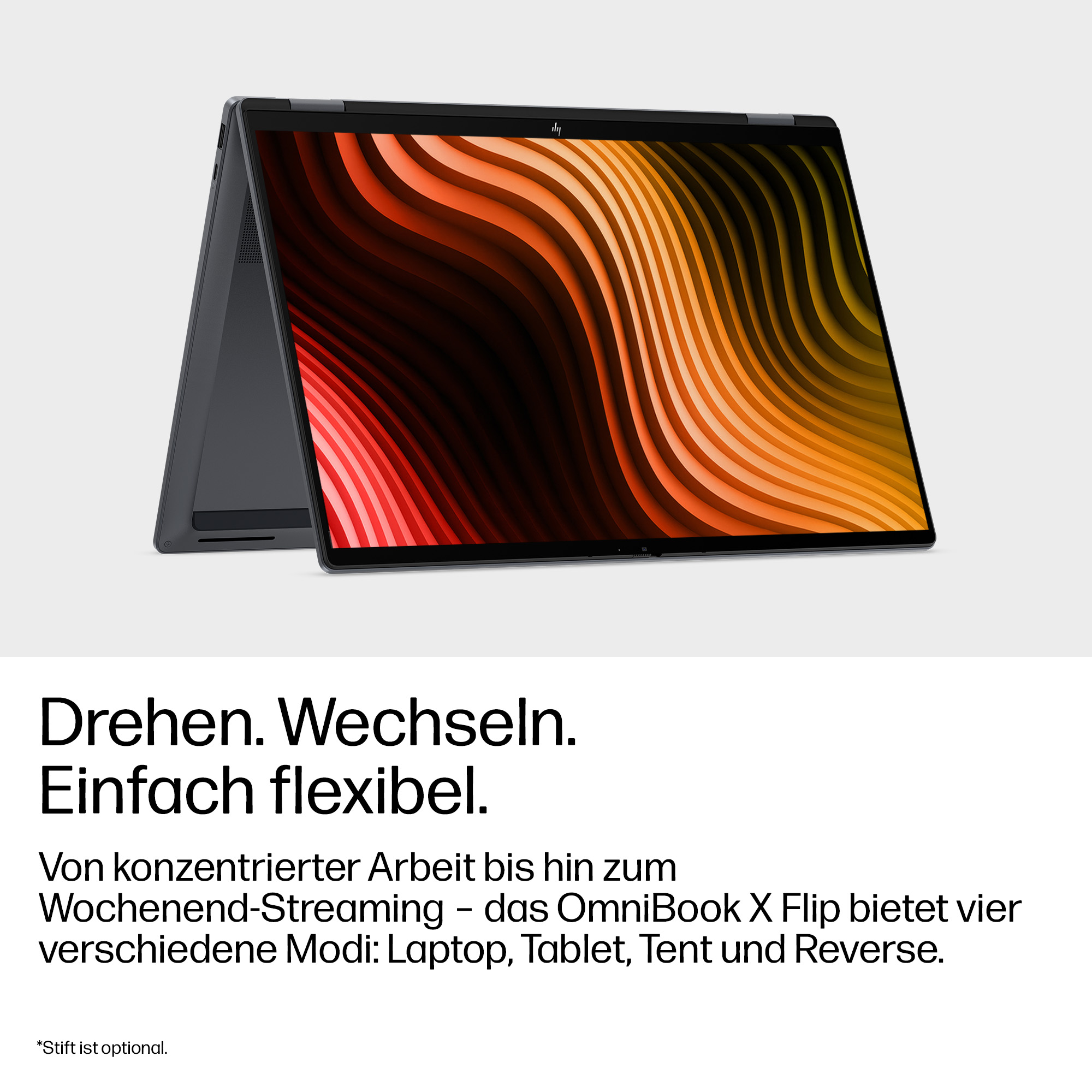 Ein graues Convertible-Laptop mit buntem Hintergrund.