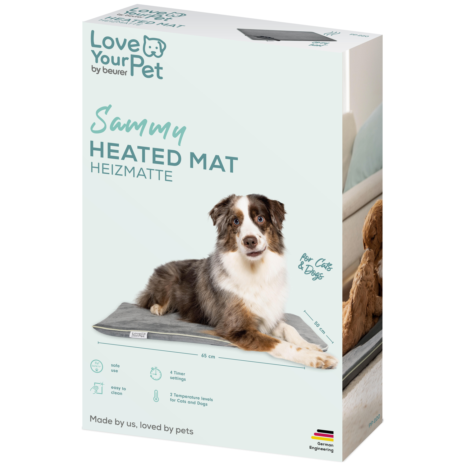 Een hond ligt op een grijze verwarmde mat met tekst "Sammy HEATED MAT".