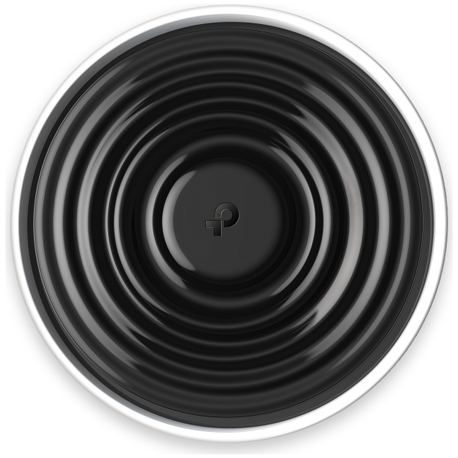 Anneaux concentriques noirs sur un objet circulaire à bord argenté.