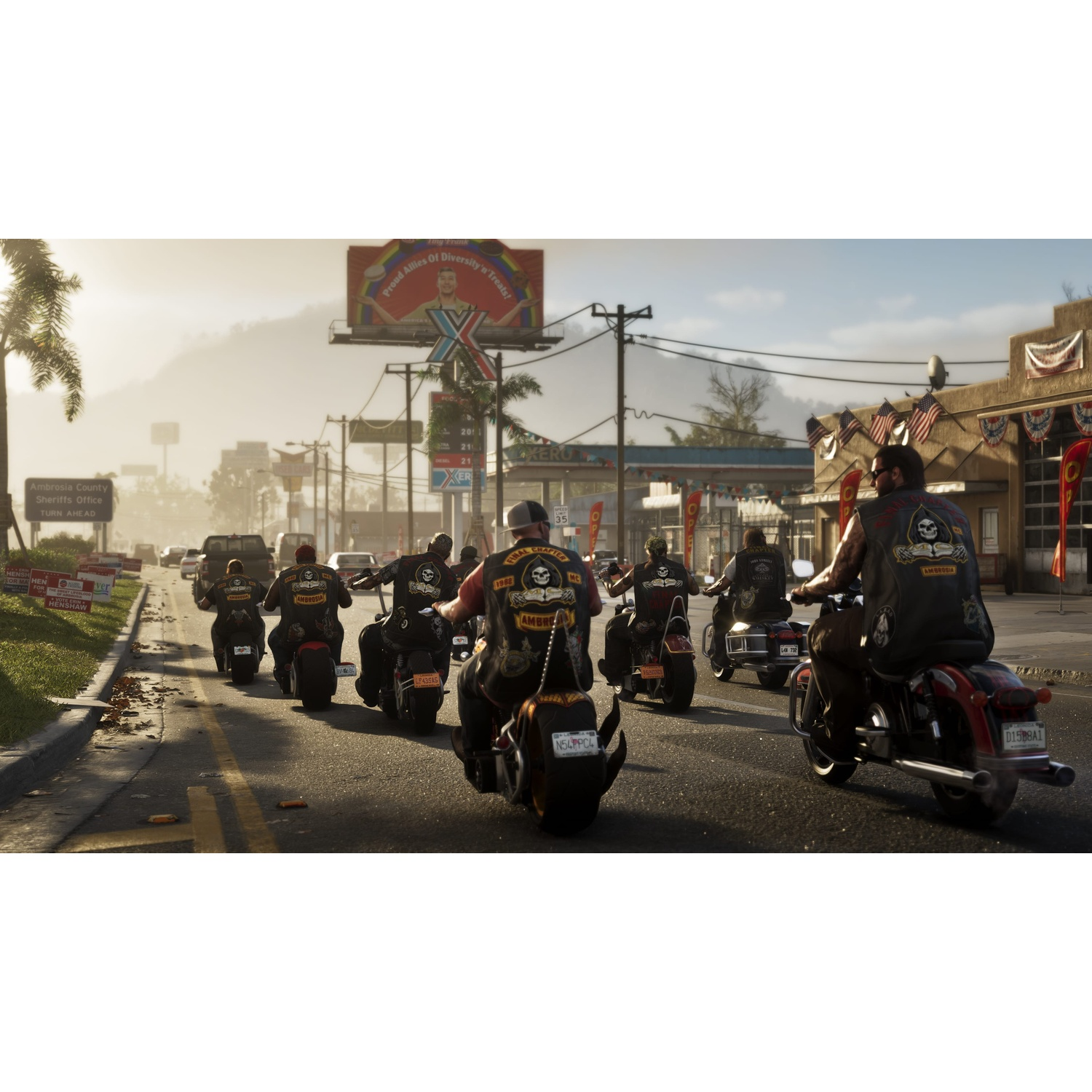 A group of bikers ride in formation down a sunny street, past a gas station and billboard.