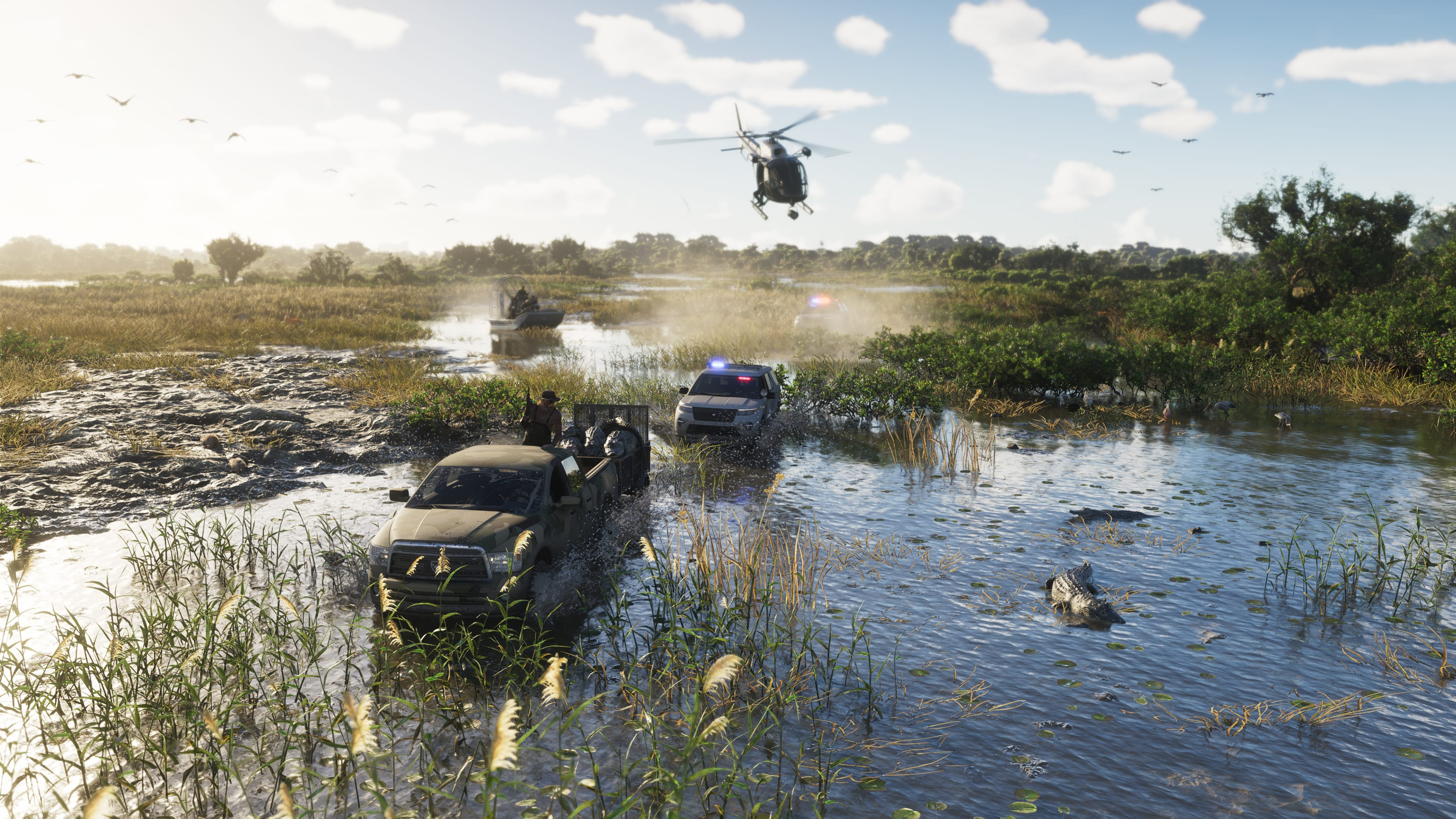 Vehículos militares y un helicóptero en un pantano con caimanes.