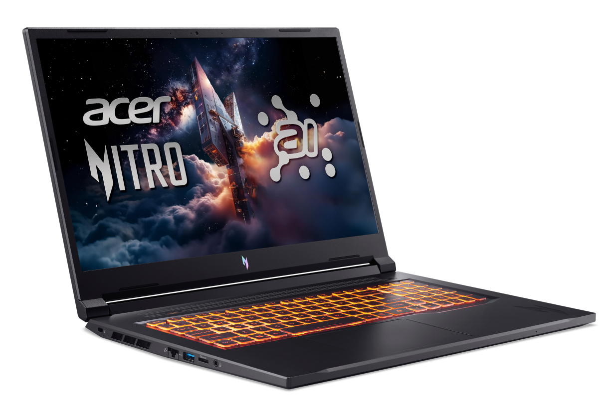 Czarny laptop z podświetlaną klawiaturą i tapetą o tematyce kosmicznej.
